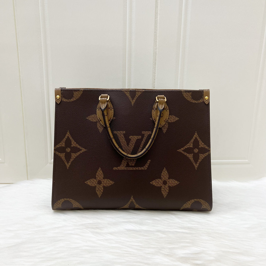 LV Onthego MM in Reverse Giant Monogram Canvas and GHW