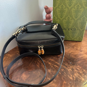 The Junco Crossbody/Clutch - Larger VS Gucci Bamboo Cosmetic Bag in Black Leather